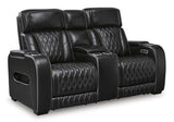 Ashley Furniture Boyington power reclining loveseat with console, showing plush upholstery and built-in cup holders.