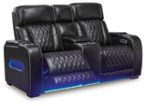 Ashley Boyington power reclining loveseat with console, shown in gray fabric, featuring plush cushions and built-in cup holders.