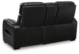 Ashley Boyington Power Reclining Loveseat with Console, featuring plush upholstery, built-in cup holders, and reclining seats.