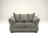 Ashley Furniture Darcy loveseat with plush fabric and cushioned arms, perfect for cozy living room seating.