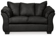 Ashley Furniture Darcy loveseat with plush upholstery and sleek modern design, shown in a cozy living room setting.