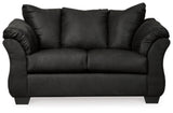 Ashley Furniture Darcy loveseat with plush upholstery and sleek modern design, shown in a cozy living room setting.