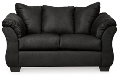 Ashley Furniture Darcy loveseat with plush upholstery and sleek modern design, shown in a cozy living room setting.