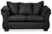 Ashley Furniture Darcy loveseat with plush upholstery and sleek modern design, shown in a cozy living room setting.
