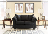 Ashley Furniture Darcy Loveseat with plush fabric and tufted backrest, perfect for cozy living room seating.