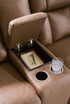 Ashley Furniture Mackmenville reclining loveseat with console, featuring plush upholstery and built-in armrest storage.