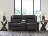 Ashley Furniture Mackmenville reclining loveseat with console, open position, showing plush upholstery and built-in cup holders.