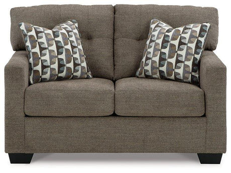 Ashley Furniture Mahoney loveseat featuring plush fabric upholstery and cushioned seating for comfortable living room decor.