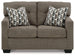 Ashley Furniture Mahoney loveseat featuring plush fabric upholstery and cushioned seating for comfortable living room decor.