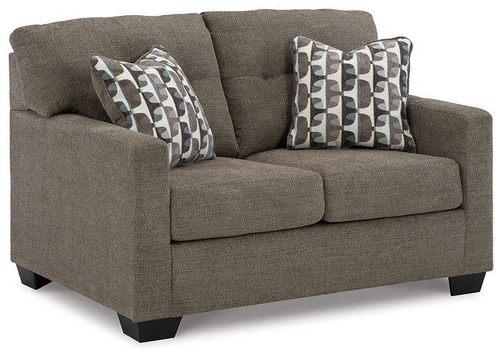 Ashley Furniture Mahoney loveseat with plush white fabric and cushioned seating, perfect for cozy living room decor.