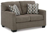 Ashley Furniture Mahoney loveseat with plush white fabric and cushioned seating, perfect for cozy living room decor.