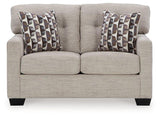 Ashley Furniture Mahoney loveseat with plush fabric and modern design, perfect for cozy living room seating.