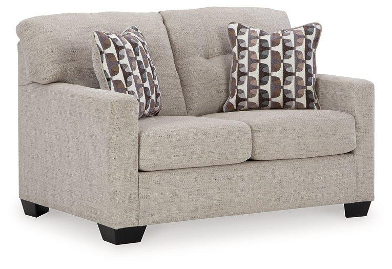Ashley Furniture Mahoney Loveseat with plush fabric and cushioned armrests, designed for cozy seating in living rooms.