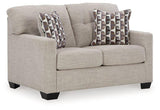 Ashley Furniture Mahoney Loveseat with plush fabric and cushioned armrests, designed for cozy seating in living rooms.