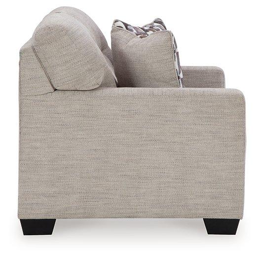 Ashley Mahoney loveseat with plush fabric and cushioned arms, perfect for cozy living room seating.