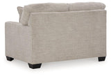 Ashley Furniture Mahoney loveseat with plush fabric, padded arms, and comfortable cushions for cozy living room seating.