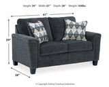 Ashley Furniture Abinger loveseat with plush fabric and cushioned backrest, ideal for cozy living room seating.