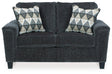 Ashley Furniture Abinger loveseat with plush fabric and cushioned armrests, perfect for cozy living room seating.