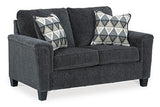 Ashley Furniture Abinger loveseat with plush fabric and cushioned arms, perfect for cozy living room seating.
