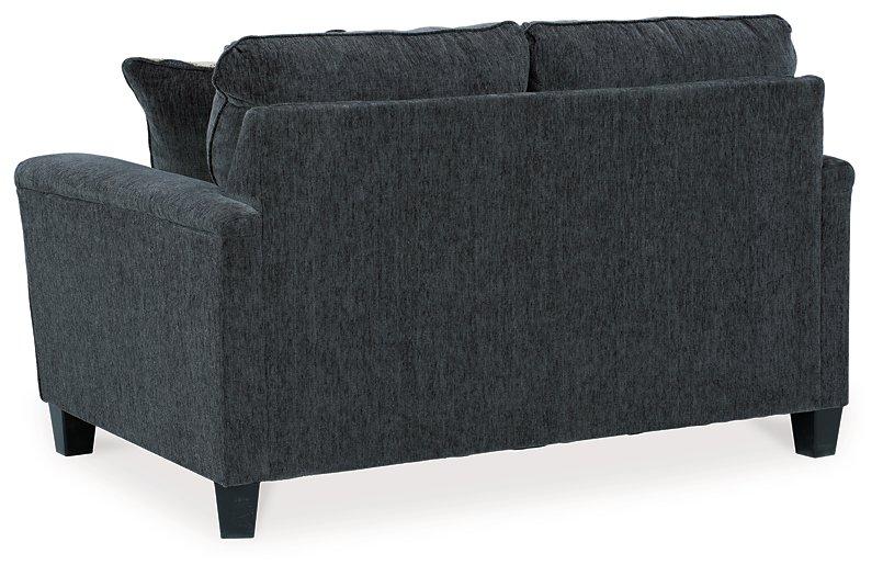 Ashley Furniture Abinger loveseat with plush fabric and cushioned armrests, perfect for cozy living room seating.