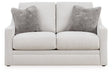 Ashley Furniture Adda loveseat with plush cushions and modern design, shown from a head-on view.