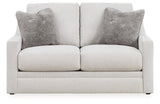 Ashley Furniture Adda loveseat with plush cushions and modern design, shown from a head-on view.