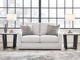 Ashley Furniture Adda Loveseat with plush fabric and modern design, shown in a cozy living room setting.