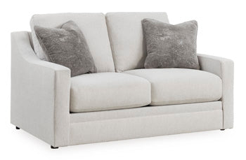 Ashley Furniture Adda Loveseat with plush cushions and modern design, shown from an angled view.