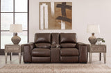 Ashley Furniture Alessandro power reclining loveseat with console, featuring plush upholstery and built-in cup holders, in a modern living room.