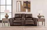 Ashley Furniture Alessandro power reclining loveseat with console, showcasing plush fabric, built-in cupholders, and reclining features.