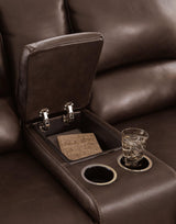 Ashley Furniture Alessandro power reclining loveseat with built-in console, featuring plush cushions and armrest storage.