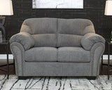 Allmaxx loveseat by Ashley Furniture, featuring plush upholstery and modern design, shown in a cozy living room setting.