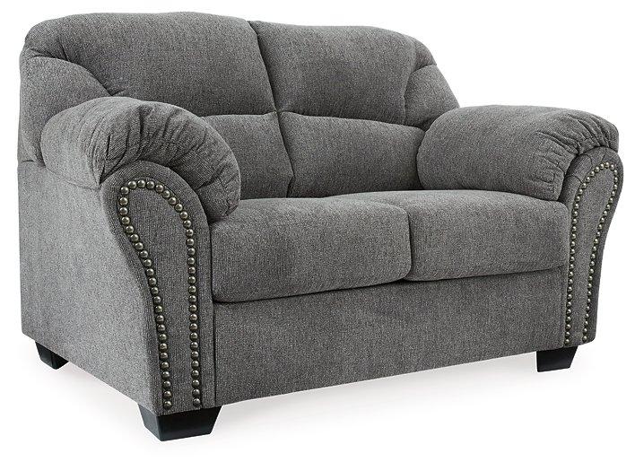 Ashley Furniture Allmaxx loveseat with plush beige upholstery and cushioned backrest, perfect for cozy living room seating.