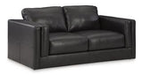Ashley Furniture Amiata loveseat with plush fabric and cushioned seats, perfect for cozy living room seating.
