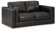 Ashley Furniture Amiata loveseat with plush fabric and cushioned armrests, ideal for cozy living room seating.