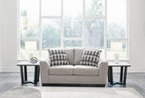 Avenal Park loveseat by Ashley Furniture, plush upholstered seating with cushions and wooden legs in a modern living room setting.