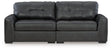 Ashley Furniture Brindley sectional loveseat with plush cushions and modern design, ideal for a comfortable living room.