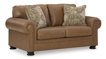 Comfortable Ashley Furniture Carianna loveseat with plush cushions and stylish fabric upholstery, ideal for cozy living rooms.