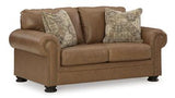 Comfortable Ashley Furniture Carianna loveseat with plush cushions and stylish fabric upholstery, ideal for cozy living rooms.