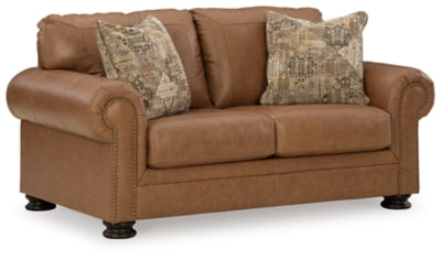Ashley Furniture Carianna loveseat shown from an angled view, featuring plush upholstery and stylish design.