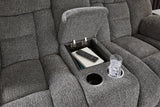 Ashley Furniture reclining loveseat with console, featuring plush cushions and built-in cup holders, perfect for cozy living rooms.