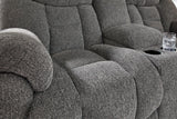 Ashley Furniture Foreside reclining loveseat with console, showing plush fabric, padded armrests, and built-in cup holders.