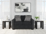 Ashley Furniture Jasmine Peaks loveseat with plush upholstery and decorative pillows, perfect for cozy living room seating.