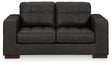 Ashley Furniture Luigi Loveseat with plush fabric, contemporary design, and comfortable cushioning for stylish living room seating.