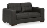 Ashley Furniture Luigi loveseat in neutral fabric with plush cushions and wooden legs, perfect for cozy living rooms.