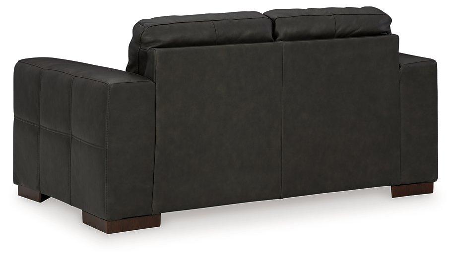 Ashley Furniture Luigi Loveseat with plush cushions and sleek design for modern living room decor.