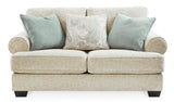 Ashley Furniture Monaghan loveseat with plush fabric and cushioned armrests, perfect for living room comfort.