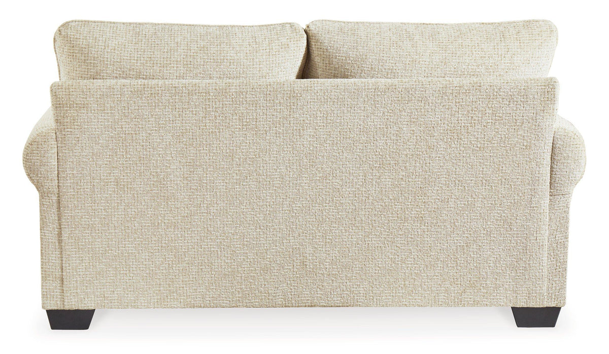 Ashley Monaghan loveseat with plush beige fabric and cozy cushions, perfect for small living rooms or cozy seating areas.