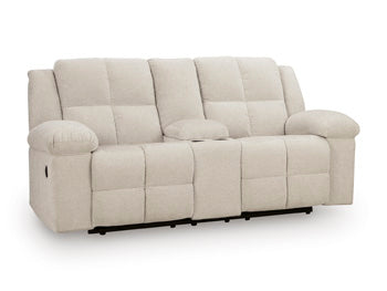 Ashley Furniture Orlen reclining loveseat with console, showing plush fabric and built-in center console from an angled view.