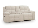 Ashley Furniture Orlen reclining loveseat with console, showing plush fabric and built-in center console from an angled view.